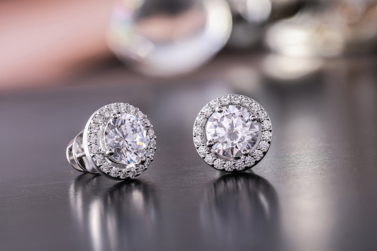 who-we-are Luxurious diamond earrings with sparkling stones, showcasing elegance and style.